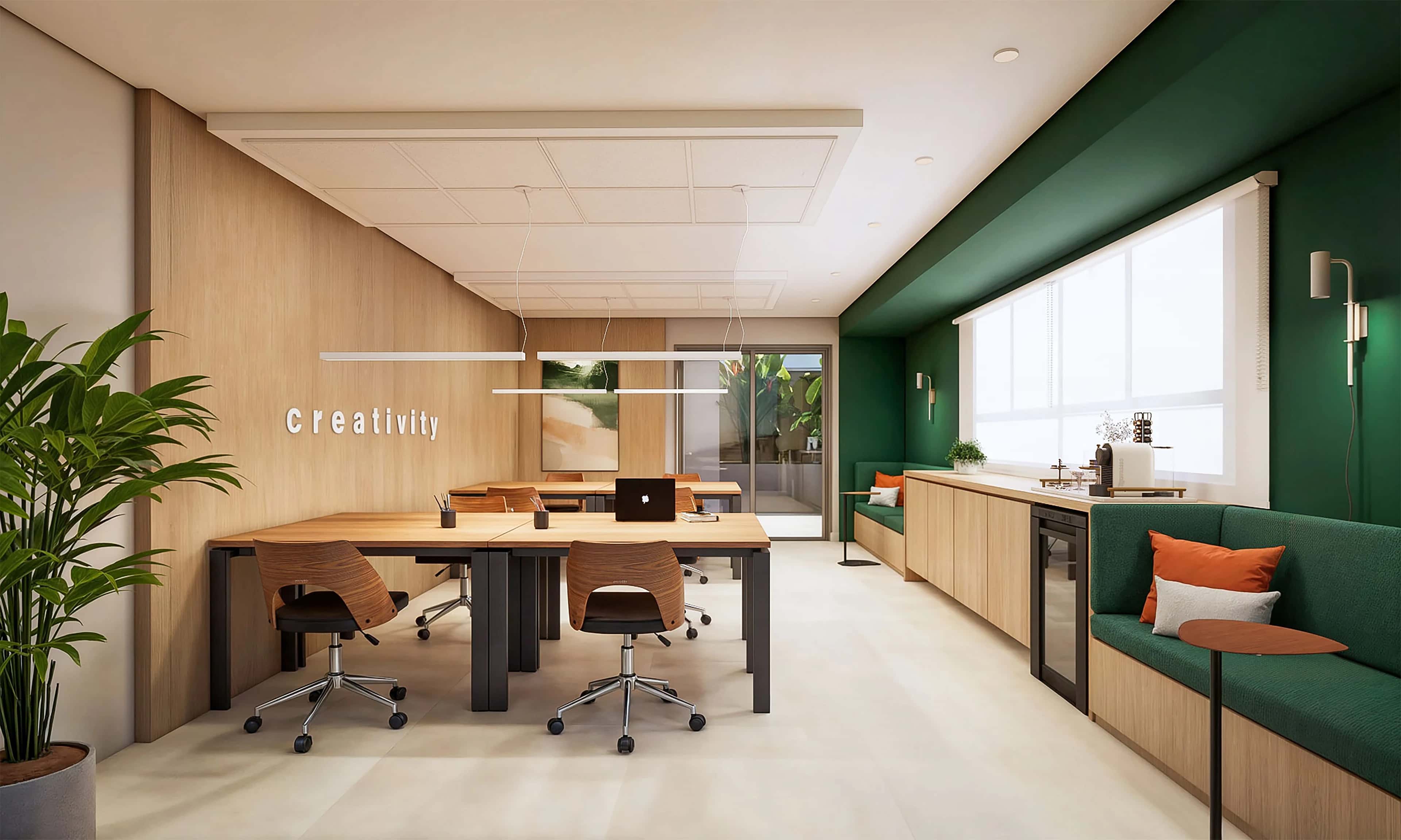 Coworking do Altus com mesa comprida e parede verde